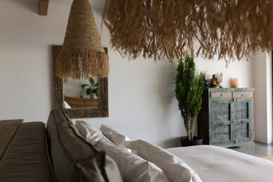 At home, white sheets and brown pillows dominating view
