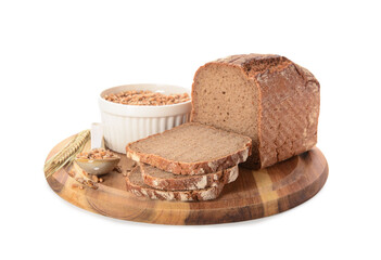 Wooden board with sliced loaf of bread, wheat spikelets and grains on white background