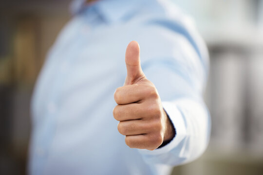 Business man, thumbs up and motivation in office, support and promotion or agreement in like emoji. Male person, yes and employee satisfaction for career opportunity, winner and thank you gesture