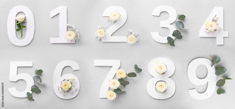 Poster Numbers and beautiful flowers on light grey background, top view. Banner design