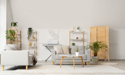 Interior of stylish living room with shelving unit, sofas and coffee table