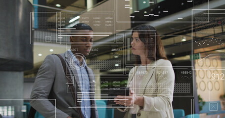 Image of graphs, loading bars, circles, diverse coworkers discussing reports on digital tablet