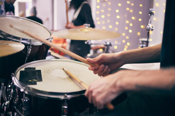 Drummer and hands at event with drums for band as musician in playing an instrument. Person, party...