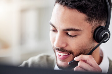 Business, call center and man with telemarketing, pc and headphones in modern office. Person, agent...