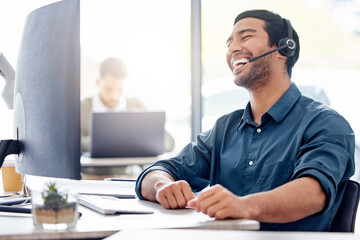 Man, laugh and computer with headset in office for support, customer with problem in Turkey. Male...
