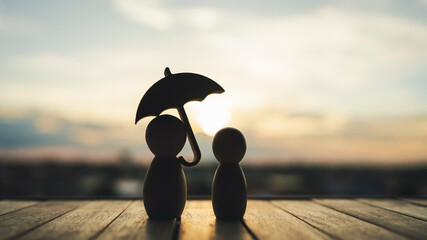 Umbrella icon and family model, Security protection and health insurance. The concept of family...