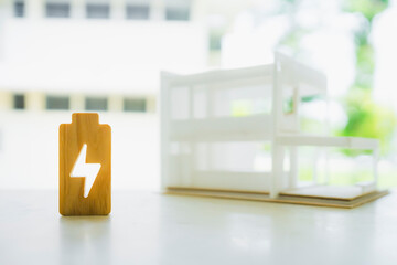 Electricity icon and house model, The concept of electricity consumption and electricity bills.