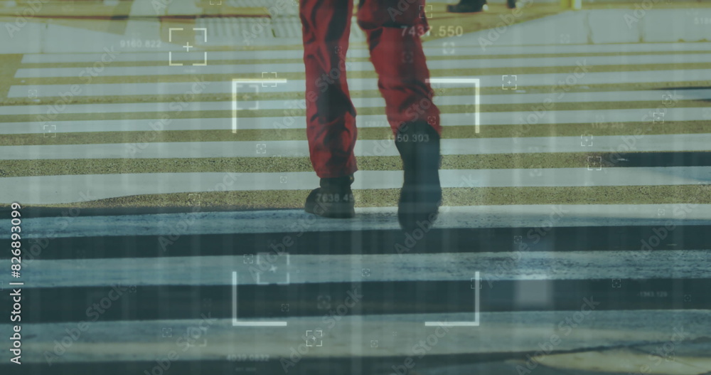 Poster image of scope scanning over low section of a man crossing the street