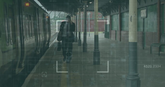 Image of financial data processing over caucasian man by train in train platform - Powered by Adobe