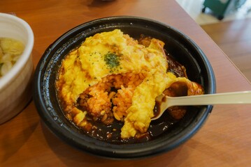 Fried rice with ketchup and omelet