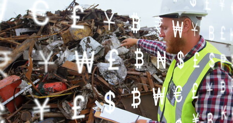 Image of multiple currency symbols against caucasian male supervisor with clipboard at junkyard