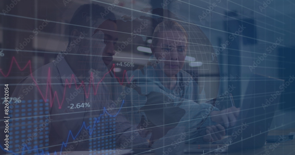 Poster image of multiple graphs and diverse colleague discussing over laptop in office