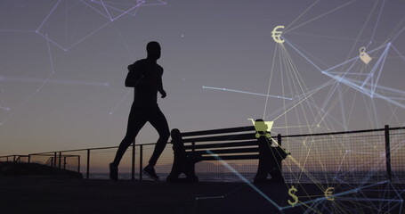 Image of connected icon globe over silhouette of african american man running at beach