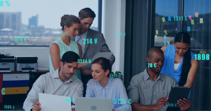 Image of changing numbers with currency symbols over diverse coworkers discussing in office