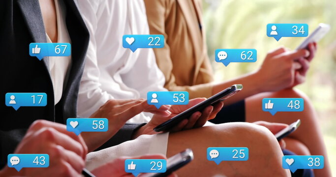 Image of notification icons with increasing number over diverse colleagues using technology