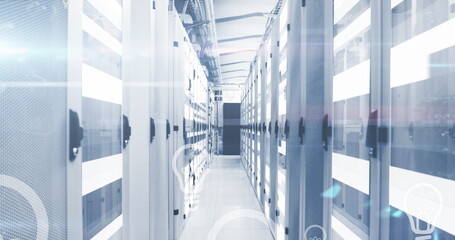 Image of light bulb icons over moving bars on data server racks in server room