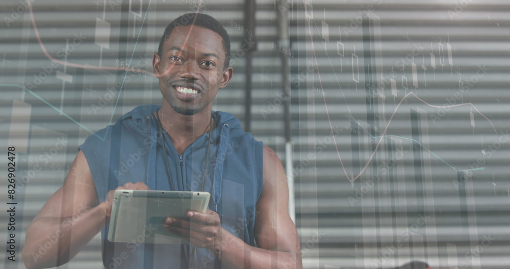 Poster image of statistical data processing over african american fit man using digital tablet at gym