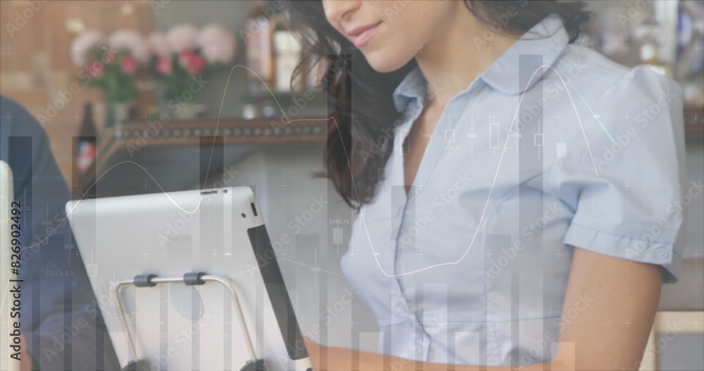 Poster image of statistical data processing over biracial woman using digital tablet at office