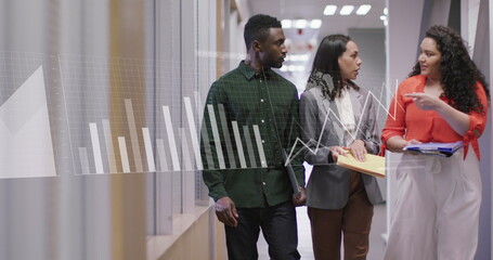 Fototapeta premium Image of statistical data processing against diverse colleagues discussing in office corridor