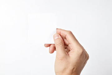 Hand holding blank white card