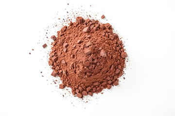 A pile of crushed chocolate powder on a white background. The powder is a rich brown color and has a textured surface. The powder is perfect for use in baking or as a decoration.