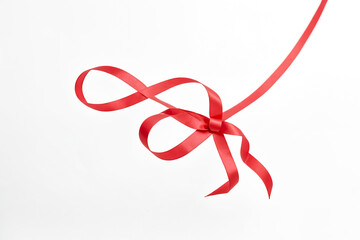 Red ribbon bow on white background