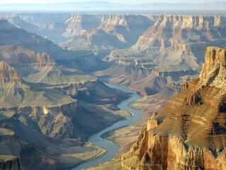 Spectacular Aerial View of the Grand Canyon with Colorado River Winding Through Majestic Rocky Landscape under Clear Skies - Powered by Adobe