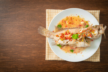 Steamed grouper fish with lime and chillies