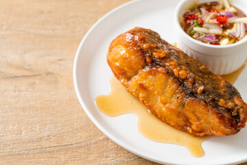 fried snapper fish with fish sauce and spicy salad