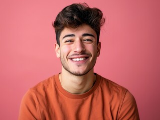 Fototapeta premium Good looking young happy smiling young man casual studio shot isolated color background