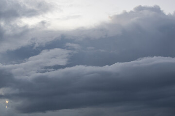 Thick stormy clouds on the sky.