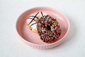 Tasty donut with chocolate glaze and sprinkle
