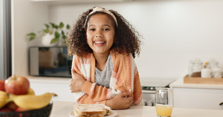 Child, portrait and kitchen for lunch sandwich or orange juice for development, nutrition or morning. Girl, kid and smile at home counter for healthy wellness for fiber snack or wheat, bread or drink