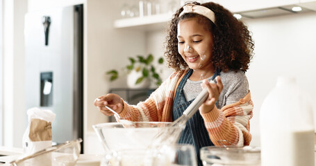 Girl, bake and mixing in home kitchen or batter, house and motor skills or childhood development...