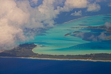 Departing Bora Bora, a picturesque island group in French Polynesia with a main island surrounded by a a lagoon with striking shades of blue and green