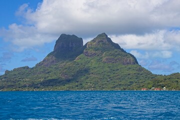 Bora Bora's extinct volcanoes rise above its beautiful lagoon