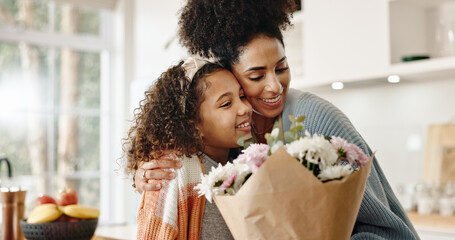 Kitchen, mother and girl with hug, flowers and present for birthday, love and family in house....