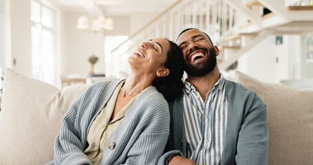 Happy couple, laughing and couch for funny joke or humor bonding in home, marriage or living room....