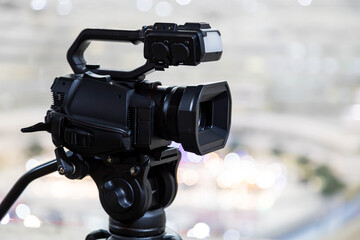 Video camera with blur background for journalist interview broadcasting reporter news or press...