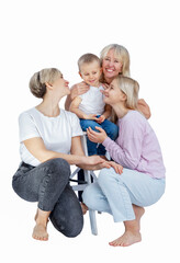 Several generations of women in a family hug and laugh with a little boy. Love and tenderness. Isolated on a white background. Vertical.