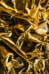 Light brown yellow silk satin. Dusty gold color. Golden luxury elegant beauty premium abstract background. Shiny, shimmer. Curtain. Drapery. Fabric, cloth texture. Christmas, birthday.