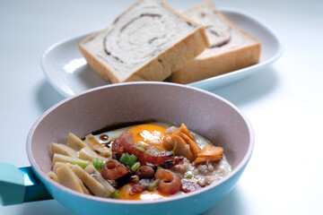 pan fried eggs with ham and sausage,thai style food