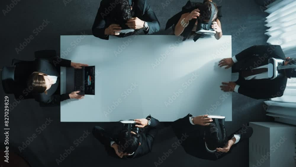Poster top down aerial view of diverse data analysts wearing vr headset and stand around table while using 