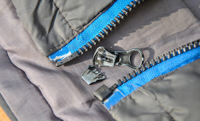 damaged zipper close-up. selective focus. broken zipper on clothes