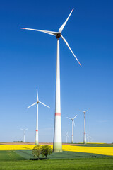 Fototapeta premium Wind turbines in agricultural fields seen in Germany