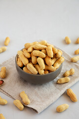Organic Raw Peanuts in a Bowl, side view.