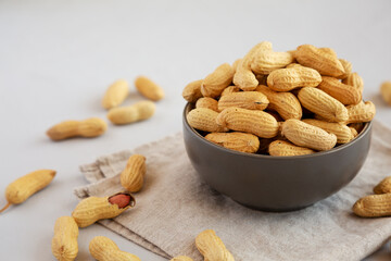 Organic Raw Peanuts in a Bowl, side view.