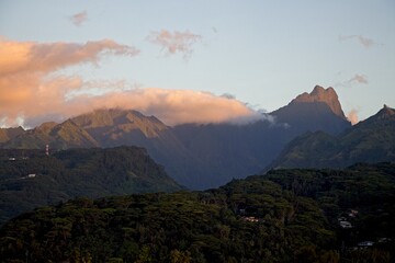 Waiting for the sunset at Venus Point Beach (Plage de la Pointe Venus) on Tahiti, with views of the peaks of Tahiti and the neighboring island of Mo'orea