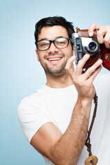 Portrait, man and photographer with camera in studio for picture, creative media and memory as...