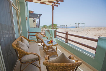 Terrace balcony with chairs in tropical luxury apartment resort